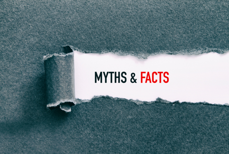 Image is of a ripped piece of paper that revels the words 'myths & facts', concept of debunking 10 DUI myths