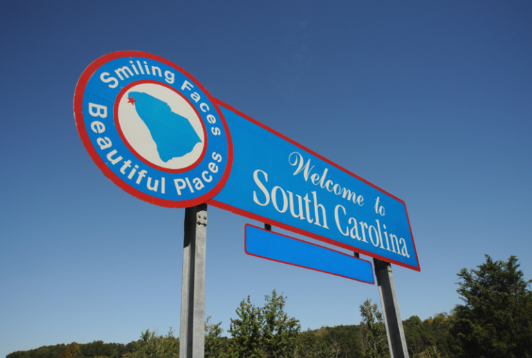 Image is of a 'Welcome to south Carolina' road sign, concept of the most dangerous roads in South Carolina.