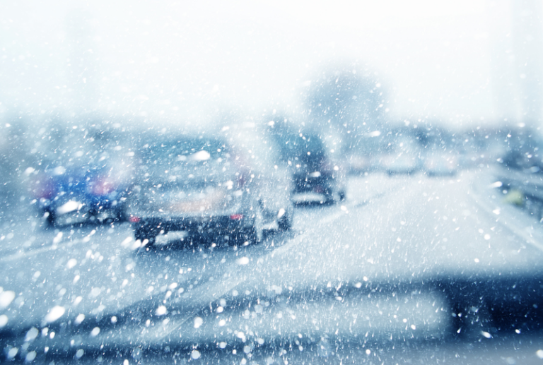 Image is of a view from a driver in their car driving in winter weather, concept of winter driving in South Carolina