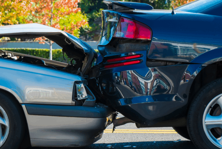 Image is of a closeup view of a rear-end collision between two cars, concept of who is at fault in a rear-end collision in Aiken