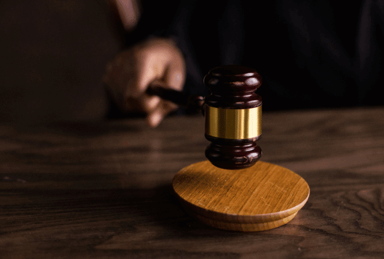 Image is of a judge pounding their gavel in a courtroom, concept of common DUI defenses in Aiken