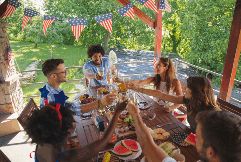 Image is of a group of friends toasting each other at a fourth of July party. concept of DUI in Aiken on 4th of July