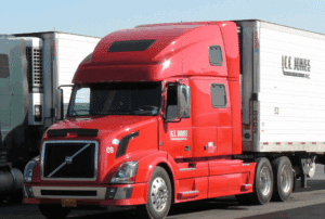 Image is of two semi trucks parked next to each other, concept of federal regulations and truck accident cases