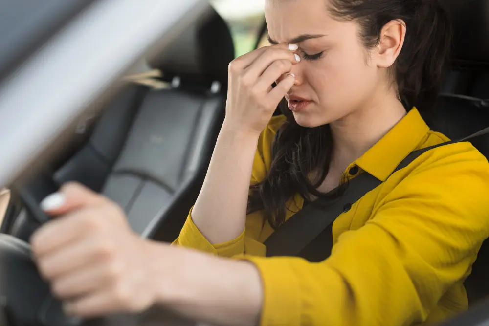 Woman driver in yellow shirt holding her head, worried about field sobriety tests in Aiken.