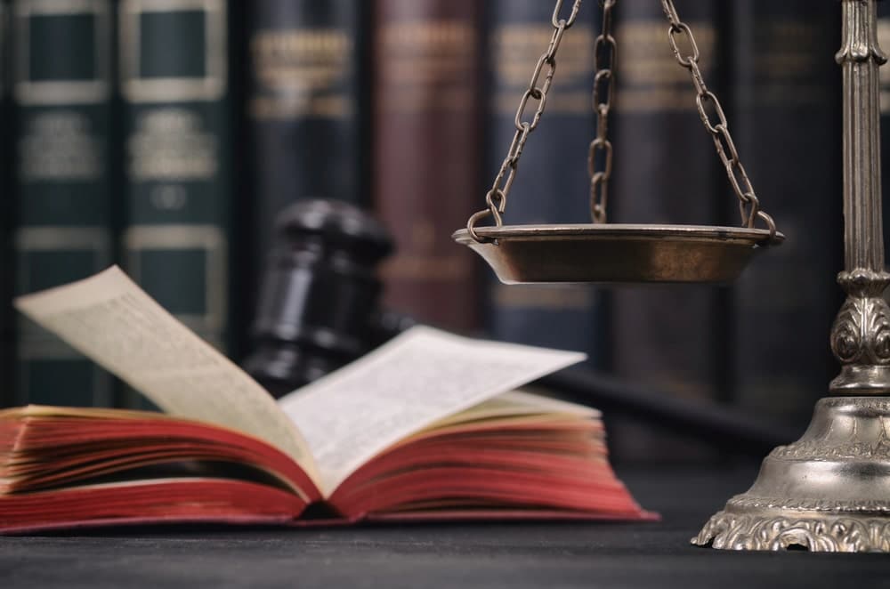 Law and justice books with gavel and scales.