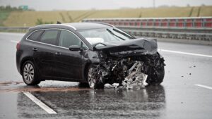 Damaged vehicle on highway after a severe car accident in Aiken.