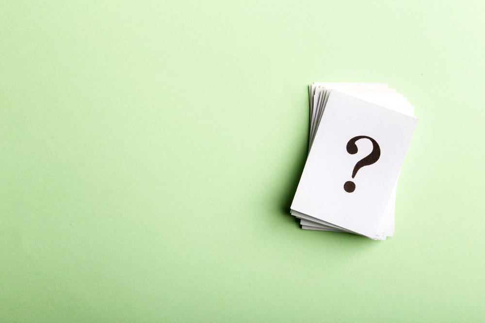 Image is of stacked cards with a question mark, symbolizing uncertainty and legal concerns after missing DUI court in Aiken.