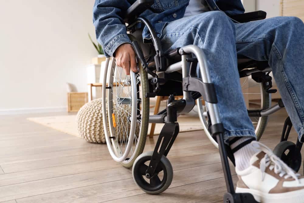 Image is of a person using a wheelchair after a severe injury, concept of an Aiken catastrophic injury lawyer helping clients recover damages for permanent disabilities.