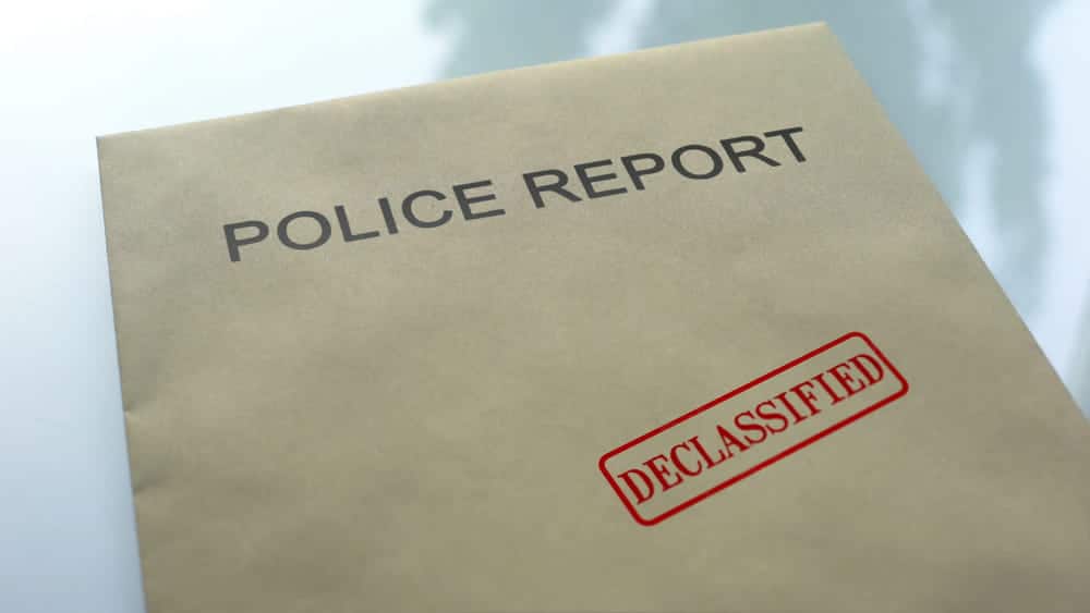 Image is of a declassified police report, representing an Aiken criminal defense lawyer preparing a client’s defense.