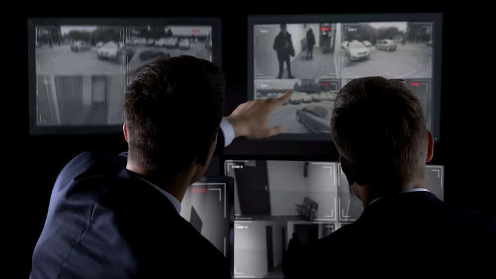 Image is of legal professionals reviewing surveillance footage on multiple monitors, concept of an Aiken drunk driving accident lawyer gathering evidence to investigate the circumstances of a DUI-related crash.