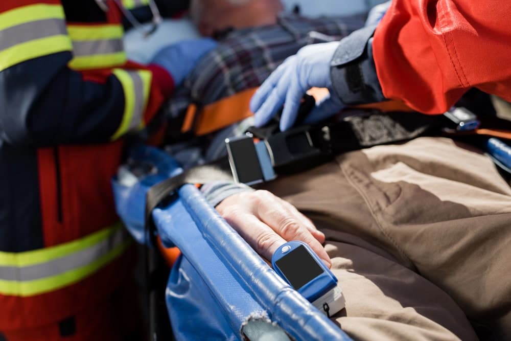 Image is of emergency responders assisting an injured person on a stretcher, concept of a felony DUI lawyer handling cases involving serious injury allegations.