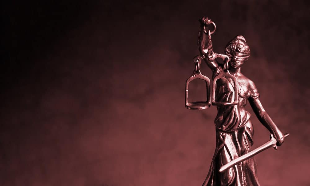 Image is of the Lady Justice statue, concept of a golf cart accident lawyer protecting the legal rights of injured accident victims.