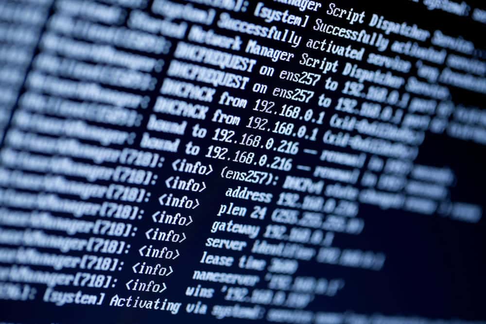 Image is of computer code displayed on a monitor, concept of an Aiken identity theft lawyer analyzing digital evidence in a cybercrime investigation.