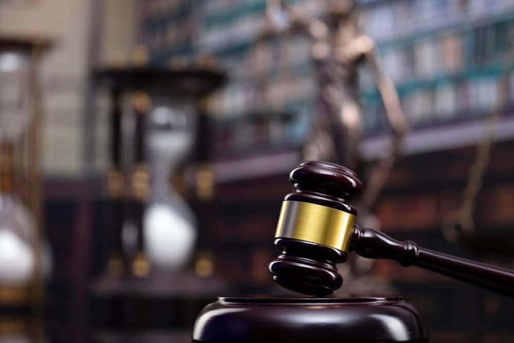 Image is of a judge's gavel in a courtroom, concept of an Aiken nursing home abuse and neglect lawyer pursuing justice for injured nursing home residents.