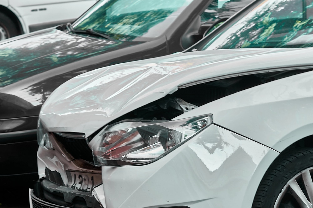 Image is of a vehicle with front-end collision damage, concept of an Uber accident lawyer assisting injured victims after a rideshare accident in Aiken.