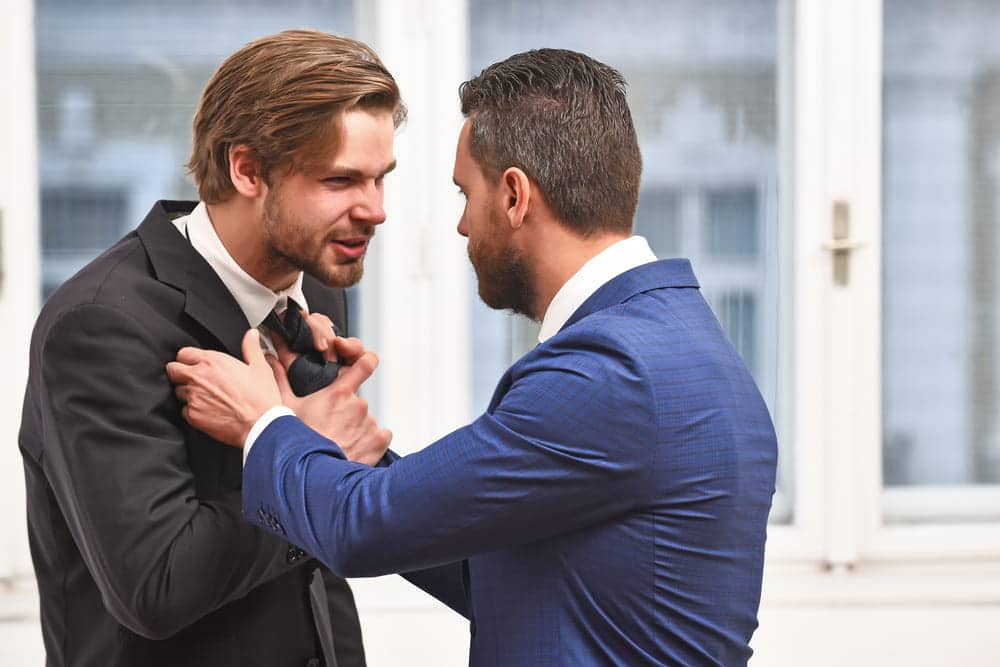 Image is of two individuals engaged in a physical confrontation, concept of a violent crime lawyer representing clients facing assault or other violent crime allegations.