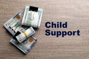 Image is of bundled cash representing financial obligations, concept of child support calculation in South Carolina.