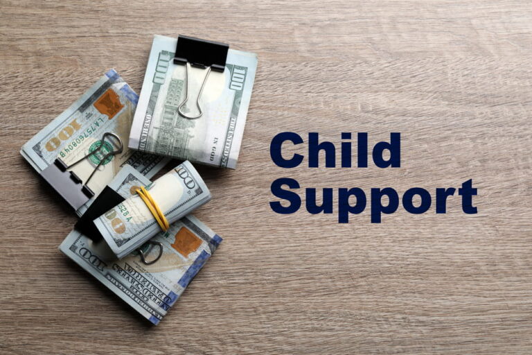 Image is of bundled cash representing financial obligations, concept of child support calculation in South Carolina.