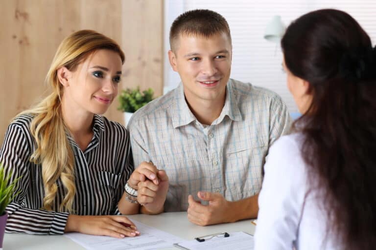 Image is of prospective adoptive parents meeting with a professional, concept of the adoption process and preparing for adoption.