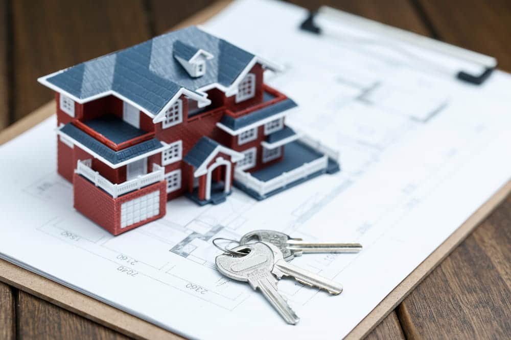 Image is of a model home, house plans, and keys, concept of how real estate property divided in South Carolina.