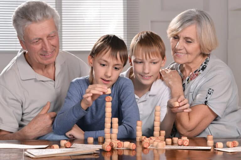 Image is of grandparents spending time with their grandchildren, concept of when grandparents seek visitation in South Carolina.